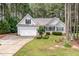 Well-maintained home with an attached garage, attractive landscaping, and a welcoming front yard at 25 Spicetree Ct, Youngsville, NC 27596