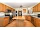 Traditional kitchen featuring stainless steel appliances, wooden cabinets and a butcher block island at 25 Spicetree Ct, Youngsville, NC 27596
