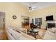 Bright and airy living room featuring high ceilings, a fireplace, and views into the dining area at 25 Spicetree Ct, Youngsville, NC 27596
