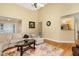 Spacious living room offering plenty of seating, hardwood floors, and an open layout to the kitchen at 25 Spicetree Ct, Youngsville, NC 27596