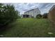 Large backyard featuring a well-maintained lawn and mature trees at 2511 Dalmahoy Ln, Fuquay Varina, NC 27526