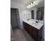 The bathroom features double sinks with a mirror and great lighting at 2511 Dalmahoy Ln, Fuquay Varina, NC 27526