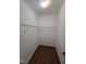 Walk-in closet with shelving and hardwood floor at 2511 Dalmahoy Ln, Fuquay Varina, NC 27526