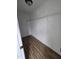 A walk-in closet with a wire rack and wood-style flooring, offering a storage solution at 2511 Dalmahoy Ln, Fuquay Varina, NC 27526