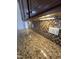 Close up of kitchen with granite countertops and mosaic tile backsplash at 2511 Dalmahoy Ln, Fuquay Varina, NC 27526