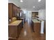 Spacious kitchen featuring granite countertops, stainless steel appliances, and mosaic tile backsplash at 2511 Dalmahoy Ln, Fuquay Varina, NC 27526