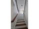 View of a staircase with wood treads and black iron railing at 2511 Dalmahoy Ln, Fuquay Varina, NC 27526