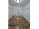 Spacious walk-in closet with wood floors, neutral walls, wire shelving, and great lighting at 2511 Dalmahoy Ln, Fuquay Varina, NC 27526