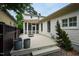A back deck is elevated with an outdoor fireplace, and an attached screened-in porch at 253 Tobacco Farm Way, Chapel Hill, NC 27516