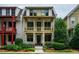 Charming two-story home with a covered front porch and stone accents and mature landscaping at 253 Tobacco Farm Way, Chapel Hill, NC 27516