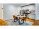 Bright eat-in kitchen featuring stainless steel appliances and a dining table for four at 253 Tobacco Farm Way, Chapel Hill, NC 27516