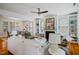 Spacious living room connected to dining room with fireplace, hardwood floors, and built-in shelves at 253 Tobacco Farm Way, Chapel Hill, NC 27516