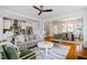 Bright, open-concept living space with hardwood floors seamlessly connecting kitchen and dining areas at 253 Tobacco Farm Way, Chapel Hill, NC 27516