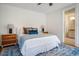 Serene bedroom with ensuite bath featuring hardwood floors and ample natural light at 253 Tobacco Farm Way, Chapel Hill, NC 27516