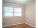 Bedroom has hardwood floors and a window bringing lots of light into the room at 2626 Crestline Ave, Raleigh, NC 27603