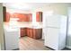 Bright, clean kitchen featuring warm wood cabinetry and modern appliances, creating an inviting space for cooking and dining at 2626 Crestline Ave, Raleigh, NC 27603
