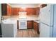 Spacious kitchen with ample cabinet space, modern appliances, and durable flooring, perfect for cooking and entertaining at 2626 Crestline Ave, Raleigh, NC 27603