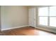 Inviting living room featuring hardwood floors and a large picture window, creating a bright and welcoming space at 2626 Crestline Ave, Raleigh, NC 27603