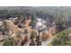 Picturesque aerial view showcasing lush greenery, a serene pond, and peaceful surroundings at 2630 Ponderosa Rd, Cameron, NC 28326