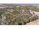 Expansive aerial view of wooded acreage providing privacy and a peaceful natural setting at 2630 Ponderosa Rd, Cameron, NC 28326