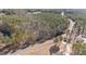 A winding road cuts through wooded acreage on this aerial view at 2630 Ponderosa Rd, Cameron, NC 28326