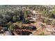 Breathtaking aerial view featuring wooded acreage, private pond, house and outbuildings at 2630 Ponderosa Rd, Cameron, NC 28326