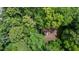 Aerial view of home's roof surrounded by a lush green forest of mature trees at 2706 Montgomery St, Durham, NC 27705