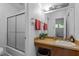 Bathroom features a vanity with a sink, a shower and tub combination, and a mirror at 2706 Montgomery St, Durham, NC 27705