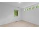 Bright bedroom showcasing a modern ceiling fan and a window offering natural light at 2706 Montgomery St, Durham, NC 27705