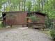 View of the house exterior, which features a wooden deck and uniquely styled trees in the yard at 2706 Montgomery St, Durham, NC 27705