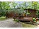View of the house exterior, which features a wooden deck and uniquely styled trees in the yard at 2706 Montgomery St, Durham, NC 27705