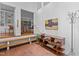 Inviting foyer featuring brick flooring, wooden shelving, and a glimpse into adjacent rooms, offering a warm welcome at 2706 Montgomery St, Durham, NC 27705