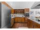 Kitchen boasts wood cabinets, stainless steel refrigerator, and ample counter space at 2706 Montgomery St, Durham, NC 27705