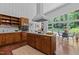 Spacious kitchen with a large island, modern appliances, and windows providing ample natural light and views at 2706 Montgomery St, Durham, NC 27705