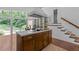 View of kitchen with center island that features a cooktop, view to an eat-in area, and backyard at 2706 Montgomery St, Durham, NC 27705