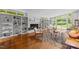 Open living room with built-in bookshelves, fireplace, and large windows offering an abundance of natural light at 2706 Montgomery St, Durham, NC 27705