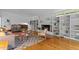 Inviting living room with a fireplace, custom bookshelves, and hardwood floors for a cozy and elegant space at 2706 Montgomery St, Durham, NC 27705