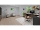 Well-lit office featuring wood-look floors, a desk and multiple chairs at 2706 Montgomery St, Durham, NC 27705