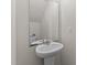 Bright half bath features a pedestal sink and a large mirror at 274 E Boulder Road Rd, Henderson, NC 27537
