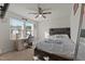 Bright bedroom with natural light, ceiling fan, and a stylish desk at 274 E Boulder Road Rd, Henderson, NC 27537