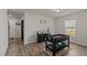 Room with foosball table, wood floors, a window, and 'Believe' wall sign at 274 E Boulder Road Rd, Henderson, NC 27537