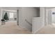 Hallway with soft neutral carpet and access to multiple rooms in a home at 274 E Boulder Road Rd, Henderson, NC 27537
