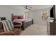 This spacious main bedroom boasts natural light and comfortable furniture at 274 E Boulder Road Rd, Henderson, NC 27537