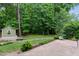 Tranquil backyard with a stream, foot bridge and charming outbuilding at 2801 Margots, Wake Forest, NC 27587