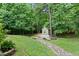 Backyard view with a stream and garden shed at 2801 Margots, Wake Forest, NC 27587