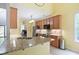 Kitchen with light wood cabinets, granite countertops, stainless steel appliances, and a kitchen island at 2801 Margots, Wake Forest, NC 27587