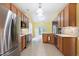 Modern kitchen with stainless steel appliances, granite countertops, and light wood cabinetry at 2801 Margots, Wake Forest, NC 27587
