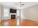 Spacious living room with hardwood floors, a fireplace, and ample natural light at 2801 Margots, Wake Forest, NC 27587