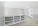 Spacious loft area featuring carpet flooring, built in bookcases, and access to several rooms at 2801 Margots, Wake Forest, NC 27587