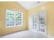 Bright sunroom with tile flooring, large windows, and access to an outdoor patio at 2801 Margots, Wake Forest, NC 27587